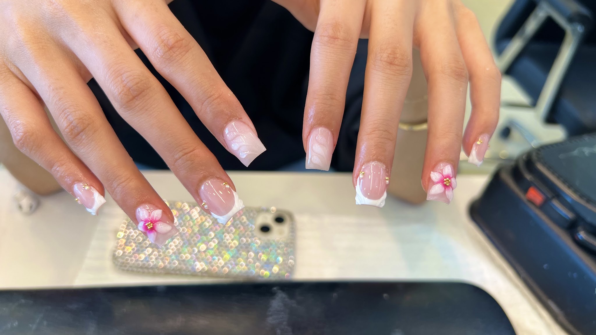 French tip square nails with 3D pink flower charms and gold studs